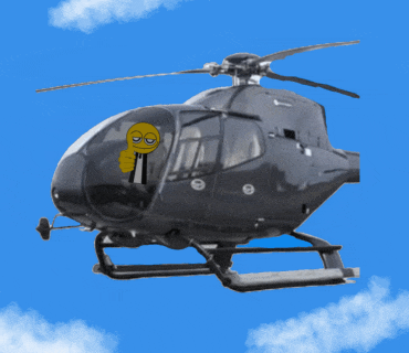 a black helicopter with a yellow smiley face on the cockpit