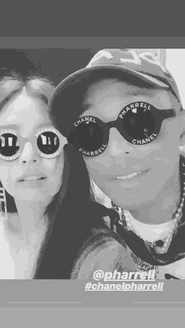 a black and white photo of a man and a woman wearing chanel sunglasses