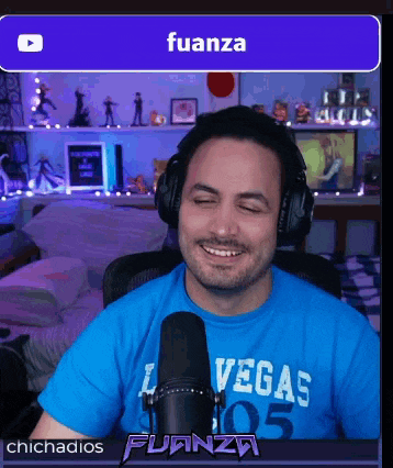 a man wearing headphones and a shirt that says las vegas 05