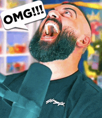 a man with a beard is laughing with a speech bubble that says omg !!