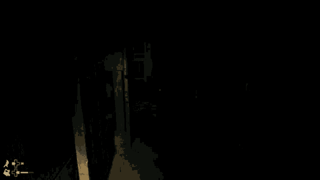 a dark room with a light shining through a doorway