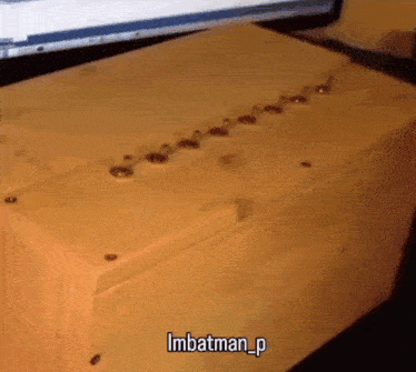 a wooden box that says imbatman_p on the top