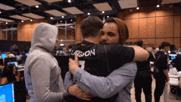 a man hugging another man with the number 7 on his back