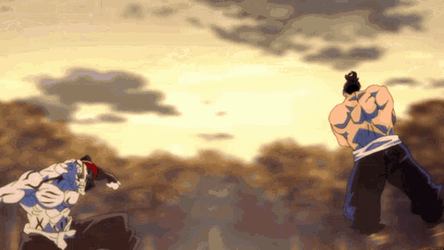 a man with a tattoo on his back is standing in front of another man