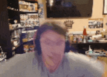 a blurry photo of a man wearing headphones