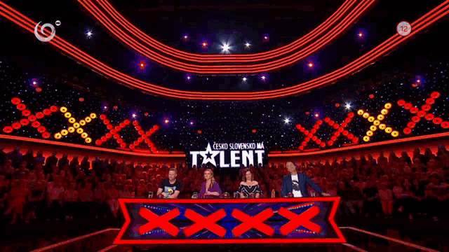 a group of people sitting in front of a sign that says talent on it