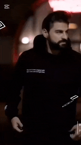 a black shirt with white wings and the words la voga vuqar talib on it