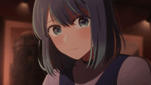 a close up of a girl with short blue hair