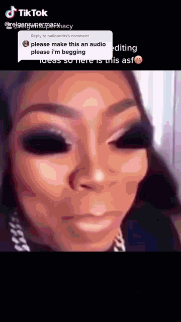 a close up of a woman 's face with a reply to balloontit 's comment