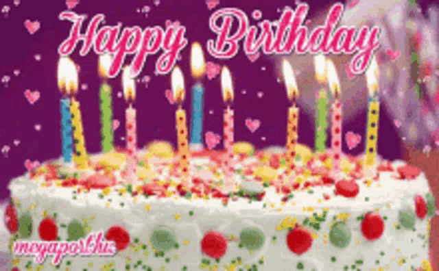 a birthday cake with candles and sprinkles and the words happy birthday on the bottom