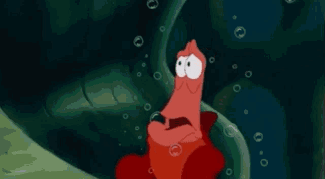 a close up of a cartoon character from the little mermaid making a funny face .