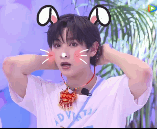 a boy wearing a necklace that says ' advert ' on it