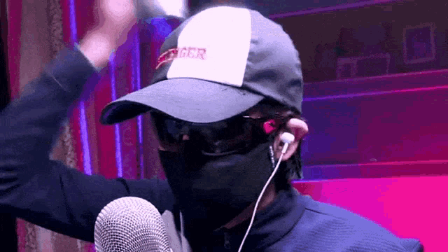 a man wearing a mask and a hat that says ggcr