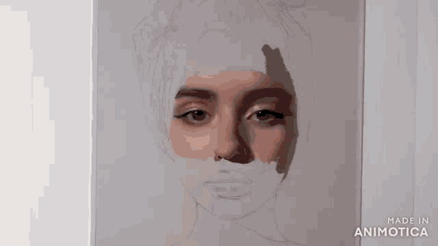 a person is painting a woman 's face with a brush on a piece of paper .