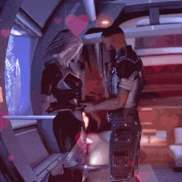 a man and a woman are standing next to each other in a room