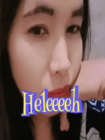 a close up of a woman 's face with the word heleeeeh above her mouth