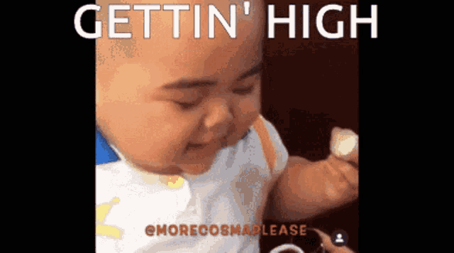 a baby is smiling and eating a banana with the caption gettin ' high