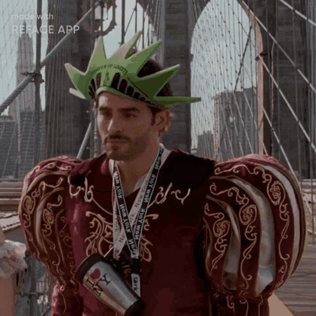 a man in a statue of liberty costume is holding a new york cup