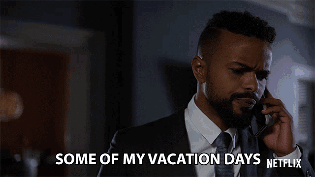 a man talking on a cell phone with the words some of my vacation days netflix