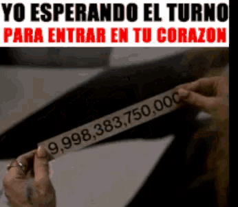 a person is holding a piece of paper that says 9,998,383,750,000 on it