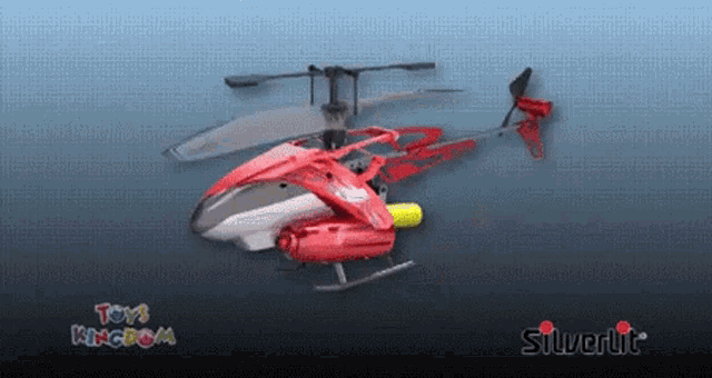 a red silverlit helicopter is displayed in a toys kingdom ad