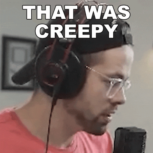 a man wearing headphones says that was creepy in front of a microphone .
