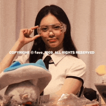 a girl wearing goggles with copyright fave_1009 all rights reserved on the bottom right