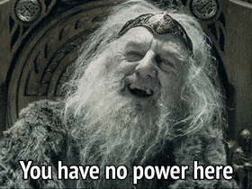 a man with a beard is sitting in a chair with the words " you have no power here " on the bottom