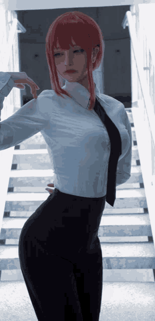 a woman with red hair wearing a white shirt and tie