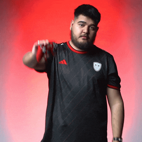 a man with a beard wearing an adidas shirt