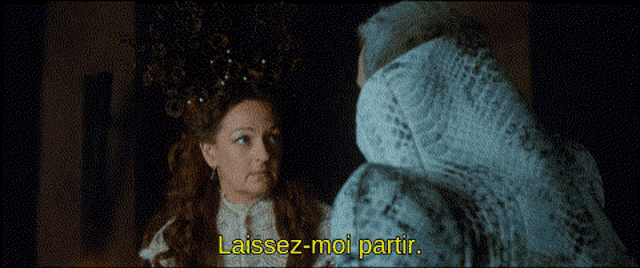 a woman in a white dress is talking to a man in a fur coat and the words laissez-moi partir are visible