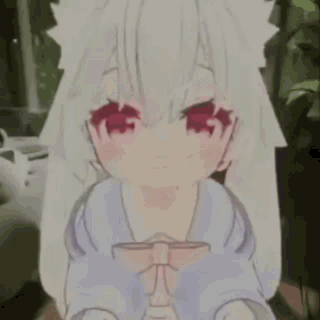 a girl with white hair and red eyes is sitting on a chair .