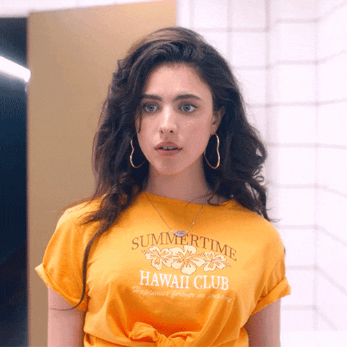 a woman wearing a yellow hawaii club shirt