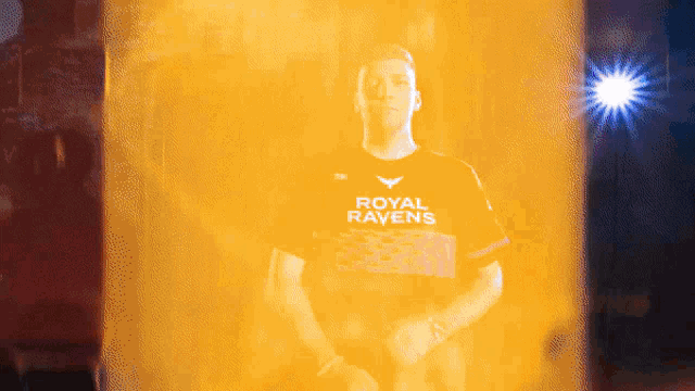 a man is wearing a shirt that says royal ravens on it
