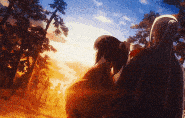 a group of people standing in a forest with a sunset in the background