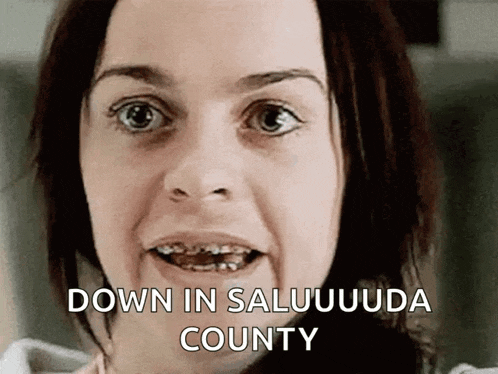 a woman with braces on her teeth is saying down in saluuuda county