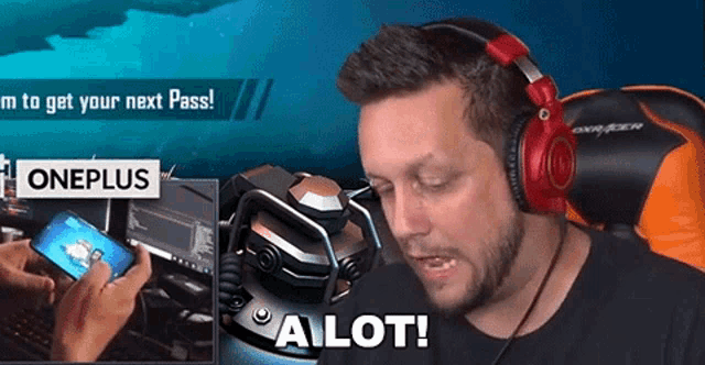 a man wearing headphones says a lot in front of a oneplus logo