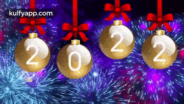 four christmas balls with the numbers 2022 hanging from ribbons