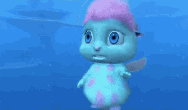 a blue and pink cartoon character is standing in the ocean .