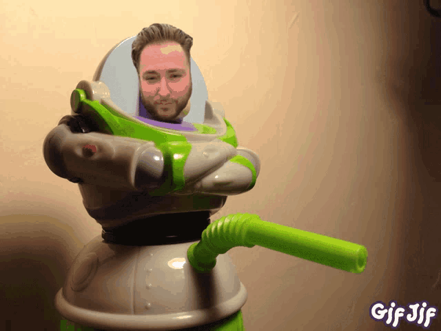 a gif of buzz lightyear with a green straw in his mouth