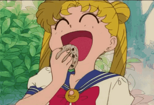 a girl in a sailor uniform is eating something