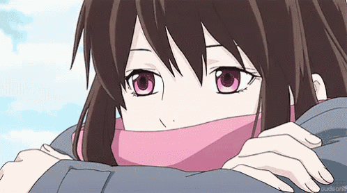 a girl with pink eyes and a pink scarf around her neck .