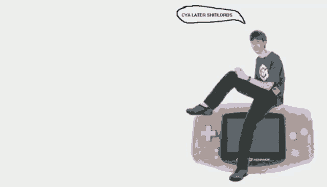 a man is sitting on top of a game boy advance controller