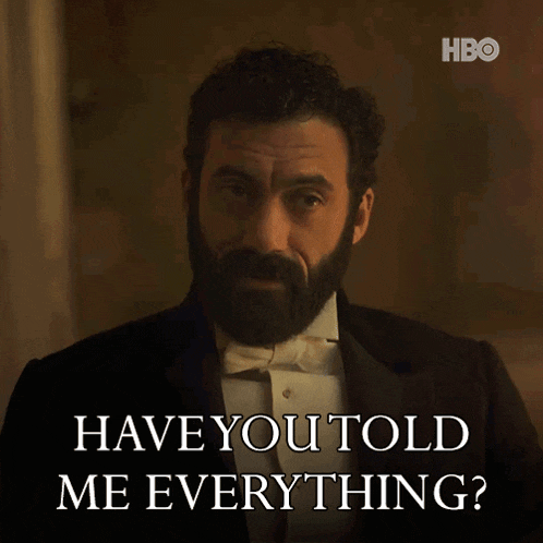 a man with a beard in a tuxedo says " have you told me everything "