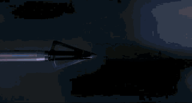 a blurry picture of a dark room with a few lights