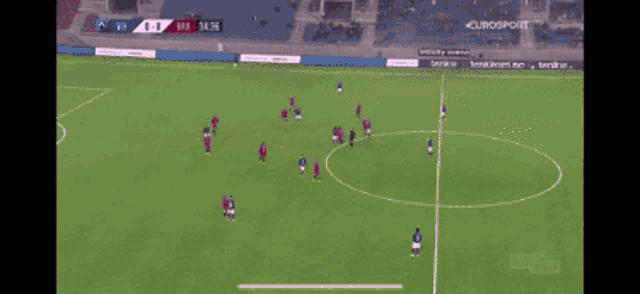 a soccer game is being played with a banner that says naregdor on it