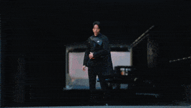 a blurred image of a person with a glowing object in their hand
