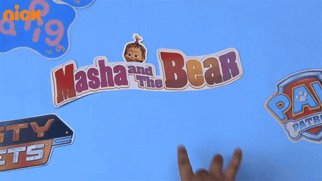 a child 's hand is reaching for masha and the bear stickers
