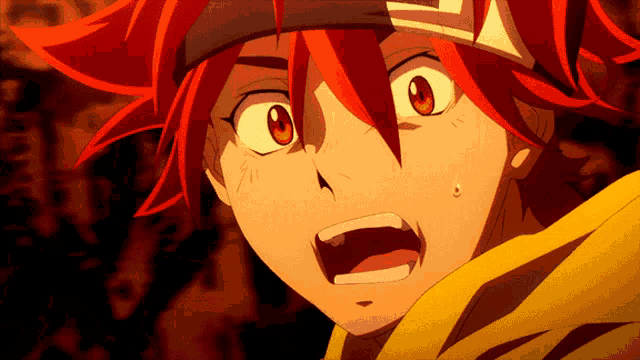 a close up of a person 's face with red hair