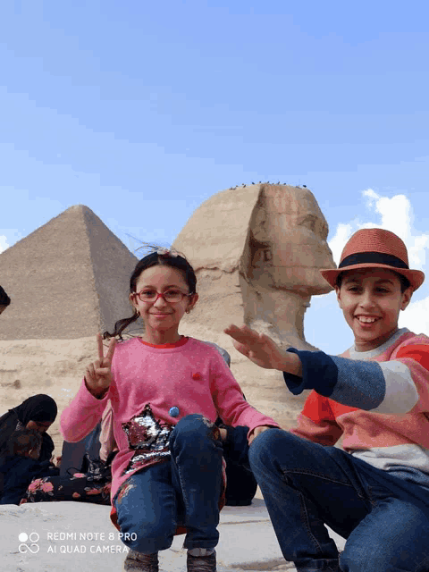 a redmi note 8 pro camera takes a picture of two children